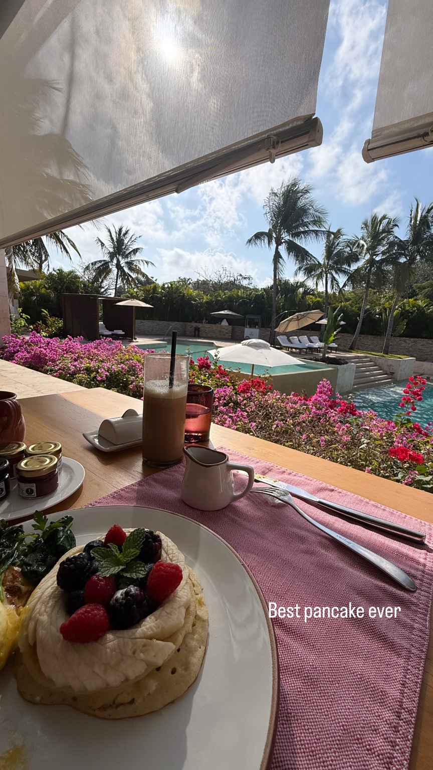 Berry pancakes with bougainvillea and pool